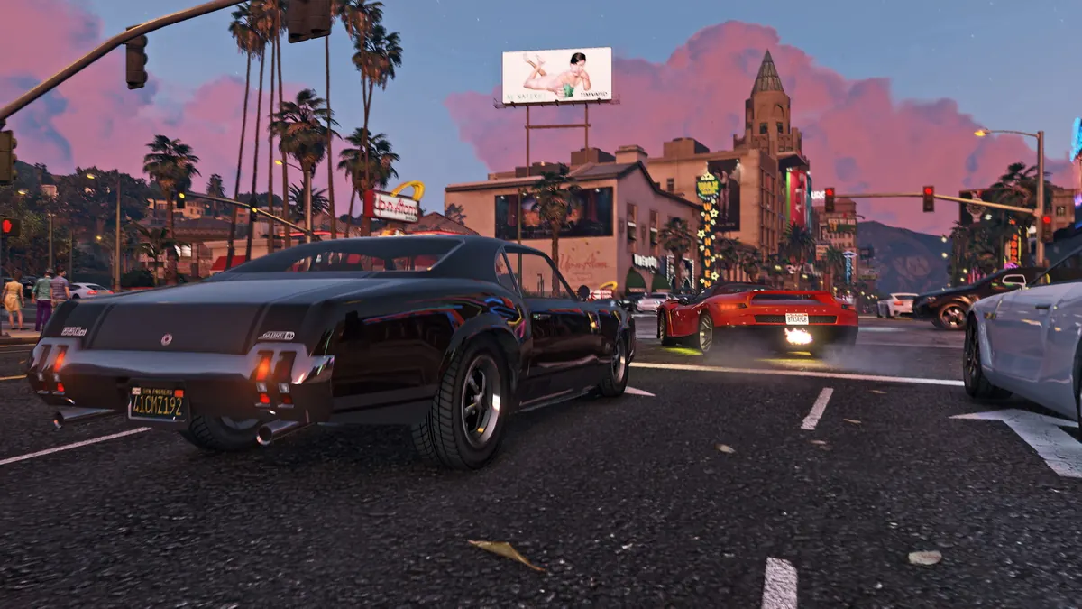 Muscle car in evening traffic on a palm-lined Los Santos boulevard in GTA V