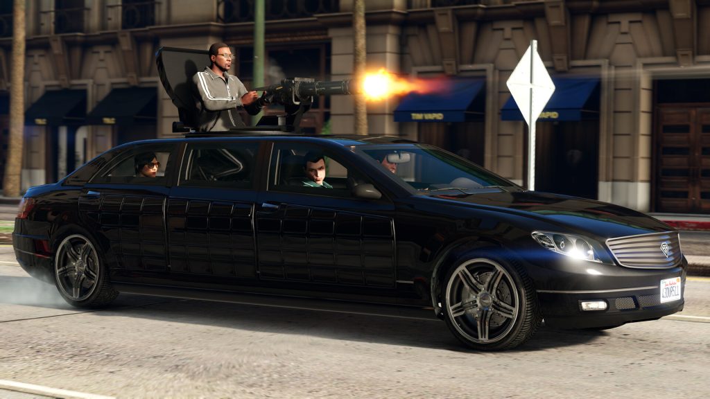 A gunner firing a minigun from the roof of a black armoured limousine on a Los Santos street